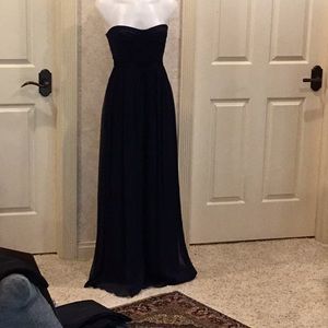 Dark navy blue gown with lining and black ribboning around waist